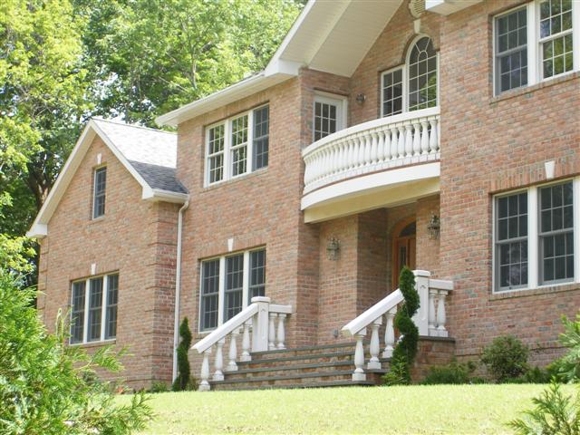 brick house with baluster railing